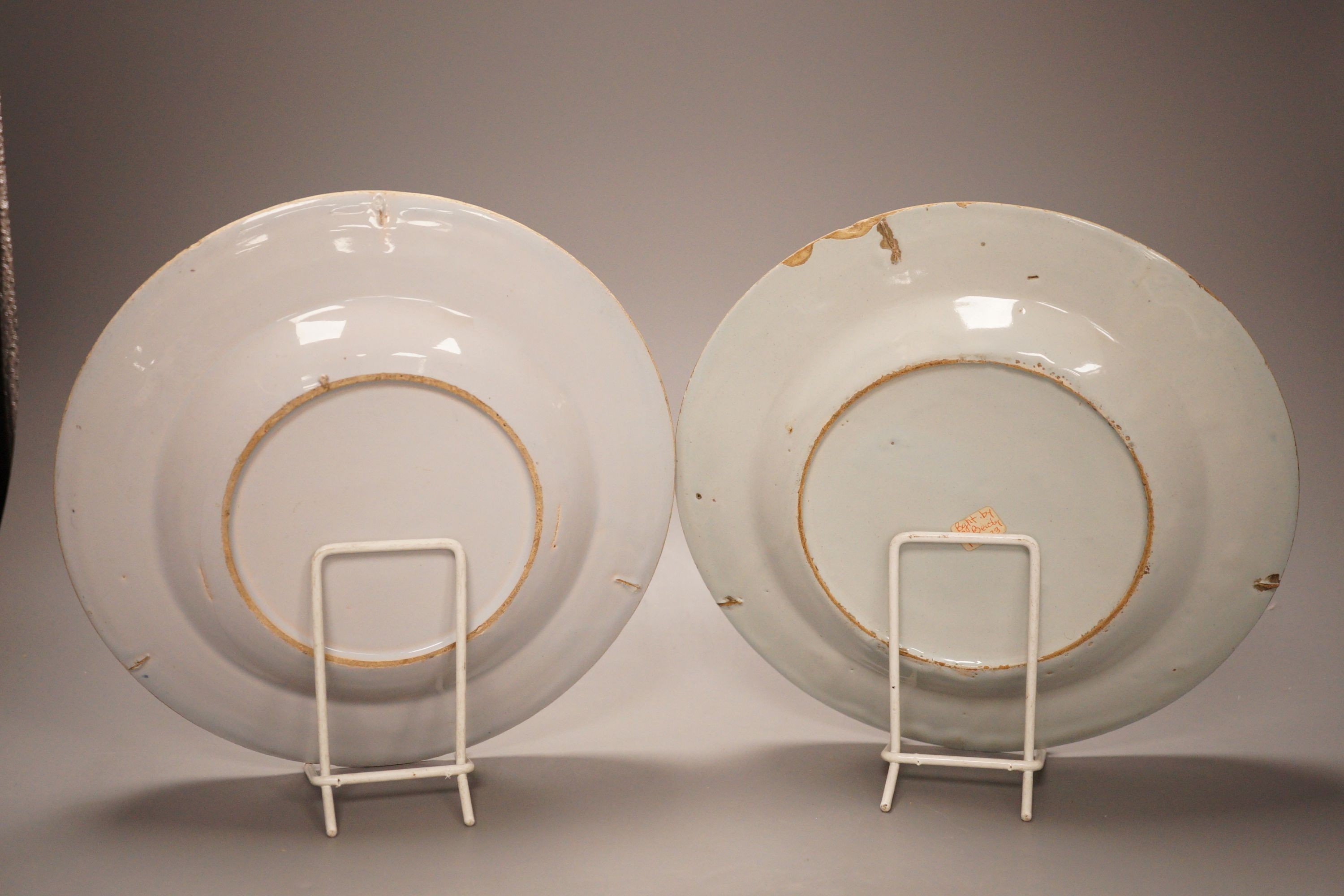 Two 18th century English delftware plates and a 18th century Delft vase, plate diameter 23cm (3)
